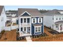 Beautiful two-story home with double porches, showcasing its charming curb appeal at 219 Symphony Ave, Summerville, SC 29486