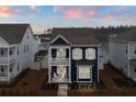 Inviting blue two-story home with dual porches, offering curb appeal and outdoor living at 219 Symphony Ave, Summerville, SC 29486