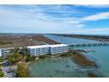 Aerial view of Twin Rivers Condominiums with access to the Intercoastal Waterway and a neighborhood view at 2395 Folly Road # 4H, Folly Beach, SC 29439