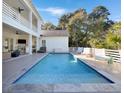 Inviting backyard pool with an outdoor seating area and sun loungers for relaxing at 27 22Nd Ave, Isle of Palms, SC 29451