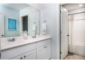 Bright bathroom featuring double sinks, modern fixtures, and a shower-tub combo at 305 Pine Crest View Dr, Summerville, SC 29486