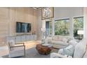 Bright and airy living room featuring a decorative ceiling, light-colored furniture, and large windows at 4 Preserve Rd, Johns Island, SC 29455