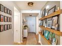 Inviting hallway featuring stylish decor, wooden floors, and decorative wall shelving at 409 Spruce Ivy St, Moncks Corner, SC 29461
