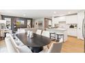 Open-concept living space with a dining area, a modern kitchen, and a comfortable seating area at 4175 Rising Tide Dr, Summerville, SC 29485