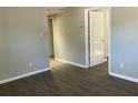 A bright living room with laminate flooring and neutral walls, leading to other rooms at 4230 S Rhett Ave, North Charleston, SC 29405