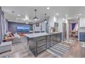 Modern kitchen with stainless steel appliances, granite countertops, an island and open to the living room at 100 Hunters Wood Dr, Summerville, SC 29485