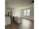 Modern kitchen featuring stainless steel appliances, white cabinetry, and a center island with a sink at 1137 Moss Grove Dr Dr, Moncks Corner, SC 29461