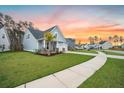 Beautiful property with green lawn, a sidewalk, and charming curb appeal at 114 Belfort Pl, Summerville, SC 29486