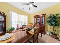 Charming dining room with wood table set, display cabinet, and decoratively tiled floor at 1227 Cosmos Rd, Summerville, SC 29483