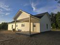 Side view of the home, featuring vinyl siding, a covered porch, and a well-maintained exterior at 149 Rose Ave, Walterboro, SC 29488