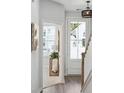 Inviting entryway with natural light, white trim and light wood flooring at 201 Abercom Place Dr, Moncks Corner, SC 29461