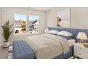 Comfortable bedroom featuring a large window and stylish blue accents at 202 Belfort Pl, Summerville, SC 29486