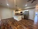 Modern open-concept kitchen featuring stainless appliances, a central island, and stylish cabinets at 2100 Booker St, Charleston, SC 29405