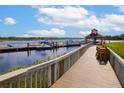 View of the community dock on the water with seating at 2333 Tall Sail Dr # G 607, Charleston, SC 29414