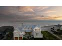 Luxury beachfront home boasting multiple decks with panoramic ocean views and private beach access at 3001 Marshall Blvd, Sullivans Island, SC 29482