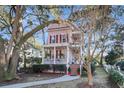 Charming two-story home with a welcoming front porch and beautiful mature trees at 3271 Johnstowne St, Johns Island, SC 29455