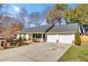 Ranch-style home with a 2-car garage, brick accents, and mature trees in a well-kept neighborhood at 3360 Pinewood Dr, Ladson, SC 29456