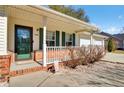 Charming front entrance with brick accents, white trim, and a cozy covered porch area at 3360 Pinewood Dr, Ladson, SC 29456
