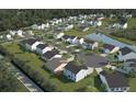 Planned community with multiple homes, green spaces, and a water feature at 5012 Scow Ct, Summerville, SC 29485