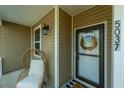 Inviting front porch featuring a cozy chair and stylish decor, enhancing curb appeal at 5037 Govan Rd, Hollywood, SC 29449