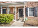 Brick townhouse with covered entrance and a well-maintained garden at 509 Reserve Way, Summerville, SC 29485