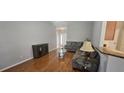 Cozy living room with comfortable seating, hardwood floors, and stylish decor, perfect for relaxing or entertaining at 7646 Kinston St, North Charleston, SC 29418