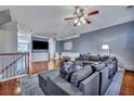Cozy living room features a large sectional sofa, hardwood floors, and neutral decor at 9024 Parlor Dr, Ladson, SC 29456