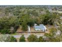 Spacious lot featuring a single-Gathering home, RV storage, and surrounded by lush, mature trees for privacy at 907 Pauline Ave, Charleston, SC 29412