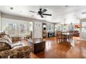 Expansive living area boasts an open floor plan, hardwood floors, large windows, and great natural light at 907 Pauline Ave, Charleston, SC 29412