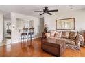 Inviting living space with hardwood floors, ceiling fan, sofa, and decorative trunk, offering cozy elegance at 907 Pauline Ave, Charleston, SC 29412