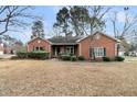 Traditional brick home with tidy landscaping, featuring a well-maintained lawn and mature trees at 101 S Gateshead Crossing, Goose Creek, SC 29445