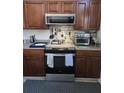 This kitchen features stainless steel appliances, including a range, microwave and plenty of counter space at 110 Greyson Cir, Goose Creek, SC 29445