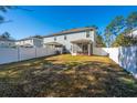 Spacious backyard with white fence and screened porch at 1610 Mermentau St, Mount Pleasant, SC 29466