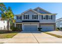 Traditional two-story home featuring attached two-car garage and inviting curb appeal at 1610 Mermentau St, Mount Pleasant, SC 29466