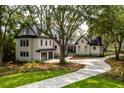 Charming two-story home with a well-manicured lawn and a circular driveway at 215 Fell Pt, Daniel Island, SC 29492
