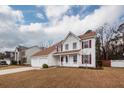 Charming two-story home features a two-car garage and a welcoming front porch in a quiet neighborhood at 3388 Forest Glen Dr, Charleston, SC 29414