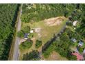 High angle aerial of property showing the expansive grounds and proximity to road at 3657 Santee River Rd, Saint Stephen, SC 29479