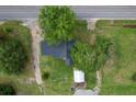 Birds eye view of home on large lot with a shed, and a backdrop of mature trees at 3657 Santee River Rd, Saint Stephen, SC 29479
