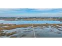 Expansive aerial view of a waterway with docks and beautiful marshland at 3970 Betsy Kerrison Pkwy, Johns Island, SC 29455