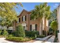 Beautiful brick home with lush landscaping and palm trees in a desirable location at 40 New St, Charleston, SC 29401
