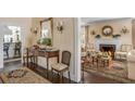 Cozy living room featuring a fireplace, hardwood floors, and stylish furnishings at 40 New St, Charleston, SC 29401