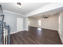 Spacious open-concept living room featuring hardwood floors, neutral walls, and crown molding at 405 Simmons Ave, Summerville, SC 29483