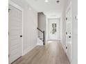 Bright hallway with hardwood floors and natural light from the front door at 422 Queenview Ln, Charleston, SC 29414