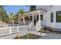 Inviting front porch with white railings, stylish landscaping, and a clear view of the house number at 519 Bank St, Mount Pleasant, SC 29464