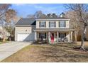 Charming two-story home with a well-maintained lawn and an inviting front porch at 544 Beverly Dr, Summerville, SC 29485