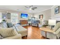 Bright living room with hardwood floors, comfortable seating, and abundant natural light at 544 Beverly Dr, Summerville, SC 29485