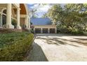 Spacious three-car garage with ample parking and a well-maintained driveway at 65 Surfsong Rd, Kiawah Island, SC 29455