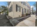 Street view of a charming home with black shutters and inviting entryway at 7 West St # C, Charleston, SC 29401