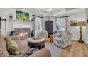 Beautiful living room featuring a fireplace, comfortable seating, wood floors, and a decorative cabinet at 739 Shamrock Ln, Charleston, SC 29412
