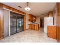 Eat-in kitchen with linoleum flooring, wood paneling, and sliding glass doors at 904 Randall Dr, Mount Pleasant, SC 29464